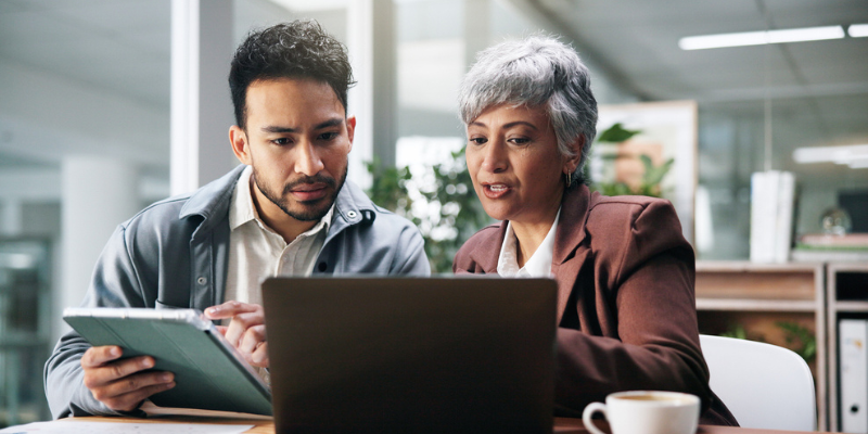 two professionals comparing managed IT services vs break-fix services