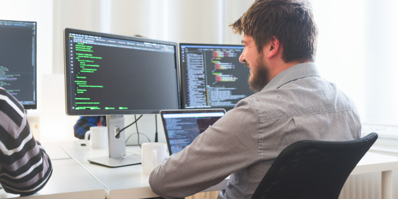 IT engineer reviewing AI-generated code to protect against vibe coding security risks